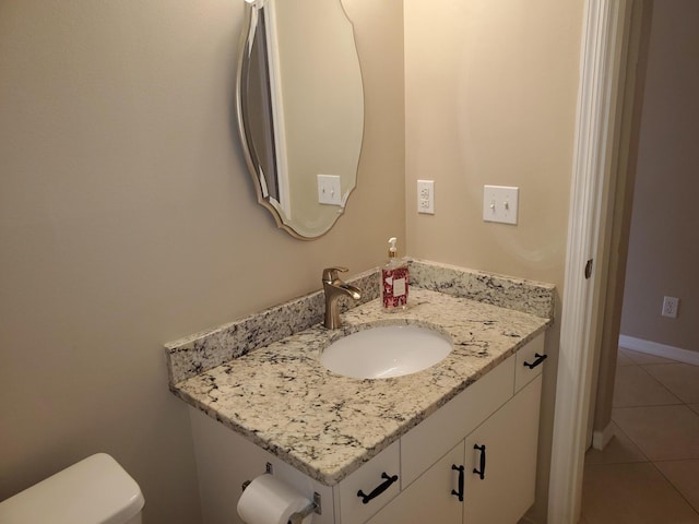 2831 Stoneway Ln Unit C, Fort Pierce, FL 34982 - bathroom featuring toilet, vanity, baseboards, and tile patterned flooring