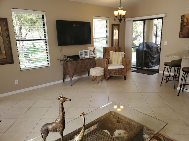 2831 Stoneway Ln Unit C, Fort Pierce, FL 34982 - interior space featuring a chandelier, light tile patterned floors, baseboards, and a wealth of natural light