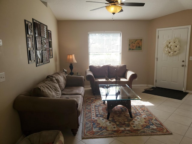 2831 Stoneway Ln Unit C, Fort Pierce, FL 34982 - living room with baseboards, light tile patterned flooring, ceiling fan, and lofted ceiling