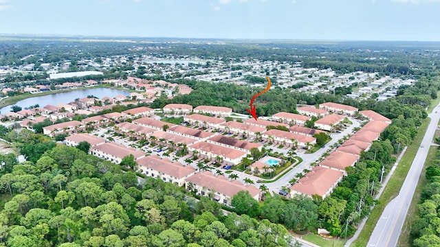 drone / aerial view featuring a water view and a residential view