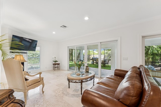 living area with visible vents, ornamental molding, and recessed lighting