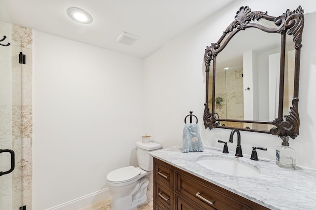 full bath featuring toilet, a stall shower, vanity, and baseboards