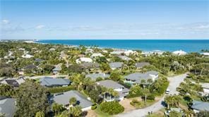 drone / aerial view featuring a water view and a residential view