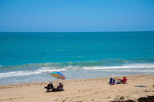 view of water feature with a beach view