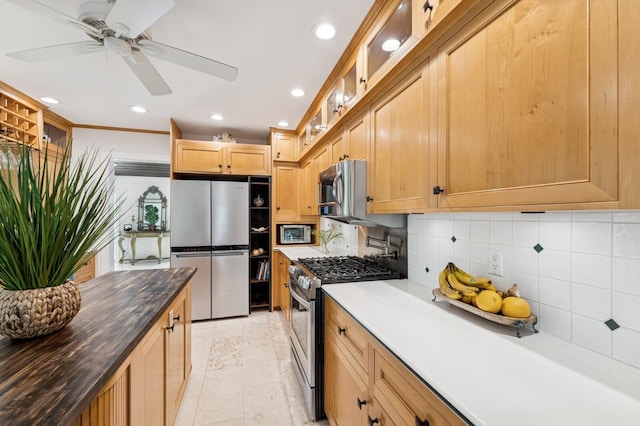 kitchen featuring recessed lighting, glass insert cabinets, appliances with stainless steel finishes, backsplash, and a ceiling fan