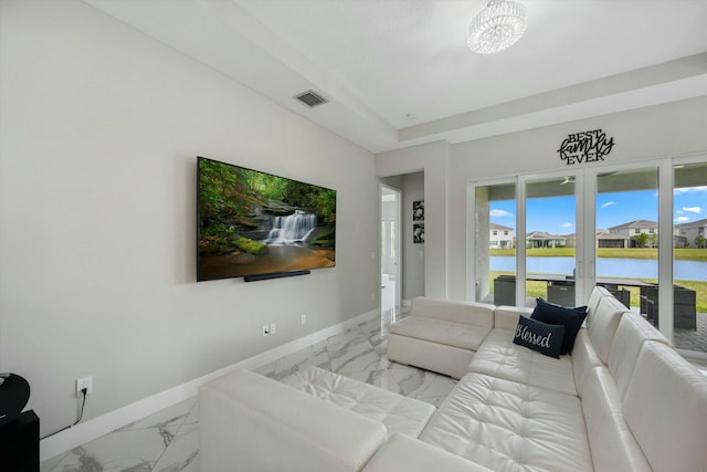 15649 Orchard Dr, Westlake, FL 33470 - living area featuring marble finish floor, baseboards, visible vents, and a notable chandelier