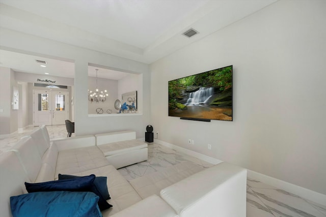 15649 Orchard Dr, Westlake, FL 33470 - living room with visible vents, baseboards, marble finish floor, and a notable chandelier