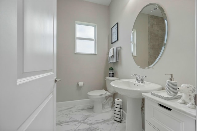 15649 Orchard Dr, Westlake, FL 33470 - bathroom with toilet, a sink, marble finish floor, and baseboards