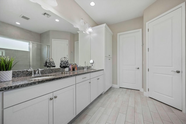 15649 Orchard Dr, Westlake, FL 33470 - bathroom featuring a sink, visible vents, a shower stall, and double vanity