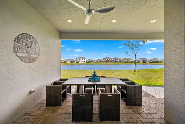 15649 Orchard Dr, Westlake, FL 33470 - view of patio featuring a water view, a ceiling fan, a residential view, and an outdoor hangout area