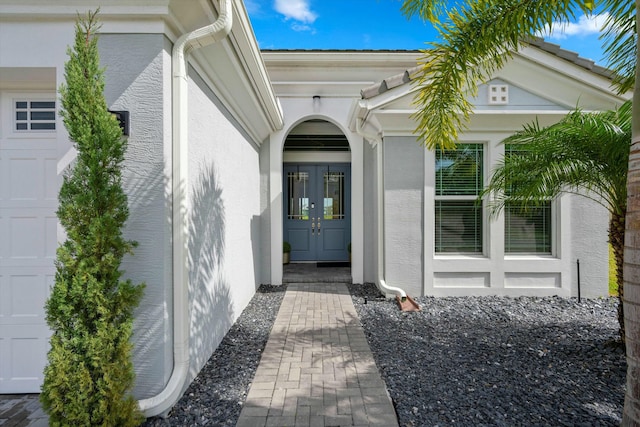 15649 Orchard Dr, Westlake, FL 33470 - doorway to property featuring french doors and stucco siding