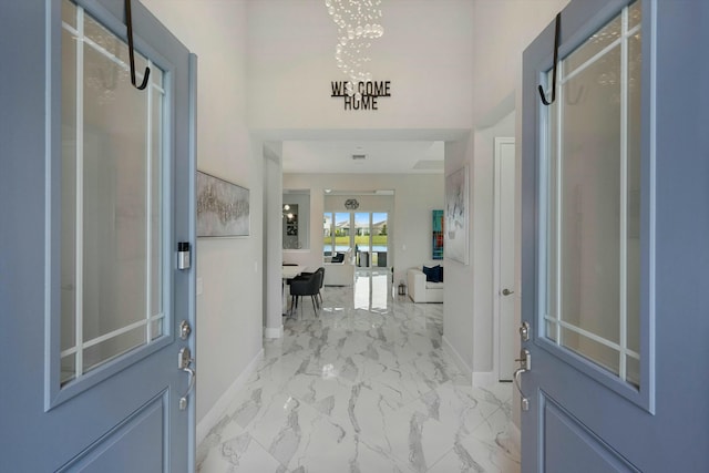 15649 Orchard Dr, Westlake, FL 33470 - entryway with marble finish floor and baseboards
