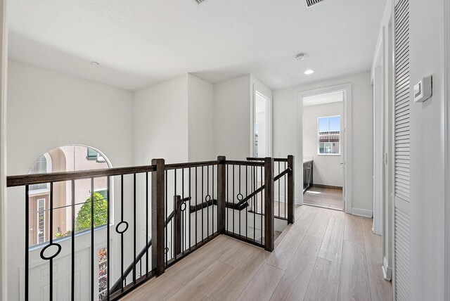 122 Diamante Way, Jupiter, FL 33477 - hallway featuring an upstairs landing, light wood-style floors, recessed lighting, and baseboards