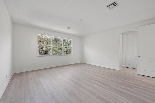 122 Diamante Way, Jupiter, FL 33477 - empty room featuring light wood-style flooring and baseboards