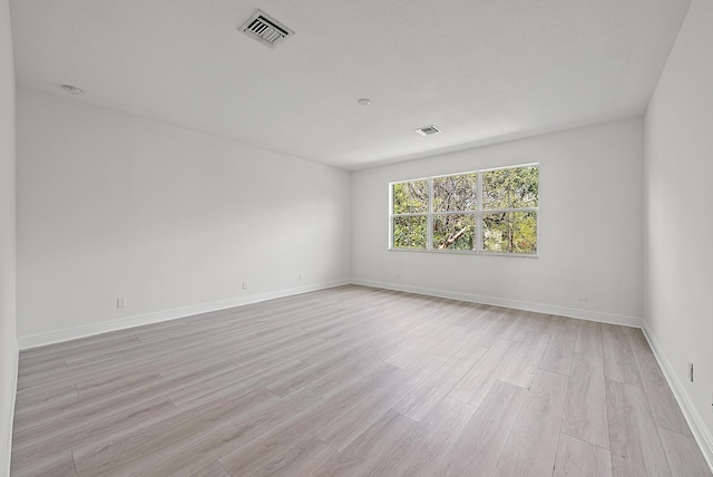122 Diamante Way, Jupiter, FL 33477 - empty room with light wood-style floors and baseboards