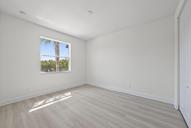122 Diamante Way, Jupiter, FL 33477 - unfurnished room featuring light wood-type flooring and baseboards