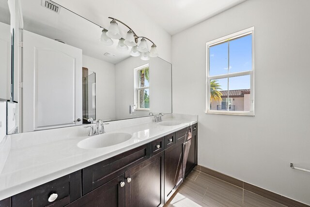 122 Diamante Way, Jupiter, FL 33477 - full bathroom featuring double vanity and baseboards
