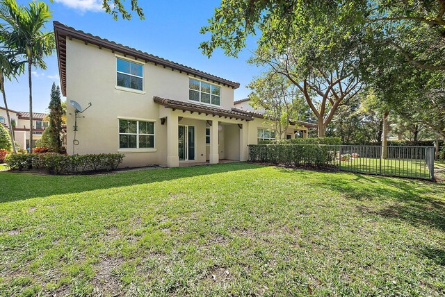 122 Diamante Way, Jupiter, FL 33477 - rear view of property featuring stucco siding and a tile roof