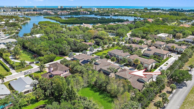 122 Diamante Way, Jupiter, FL 33477 - aerial perspective of suburban area with a nearby body of water and a tree filled landscape