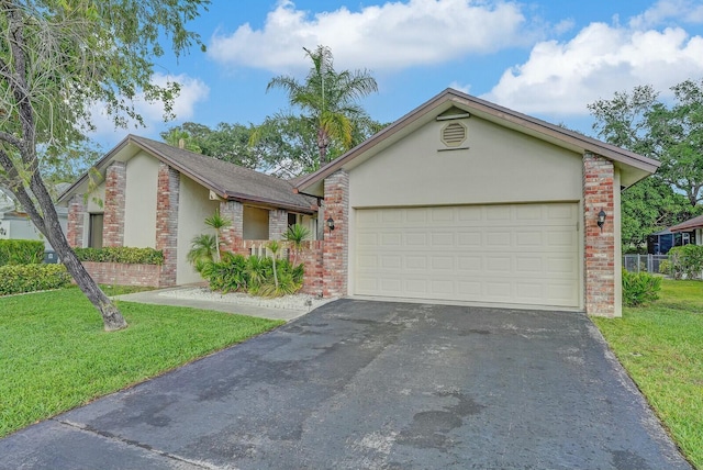 18356 181st Cir S, Boca Raton, FL 33498 - ranch-style home featuring aphalt driveway, a front yard, stucco siding, and a garage