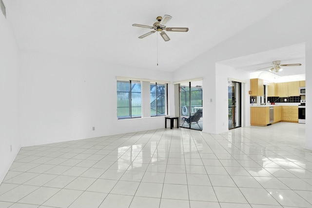 18356 181st Cir S, Boca Raton, FL 33498 - unfurnished living room featuring light tile patterned floors, a ceiling fan, and lofted ceiling