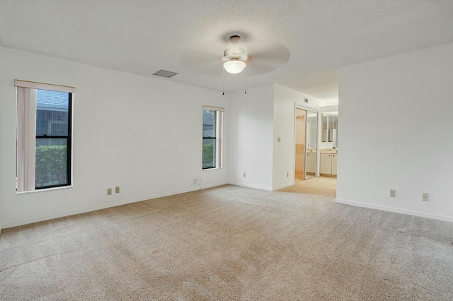 18356 181st Cir S, Boca Raton, FL 33498 - spare room featuring a healthy amount of sunlight, visible vents, light colored carpet, and ceiling fan