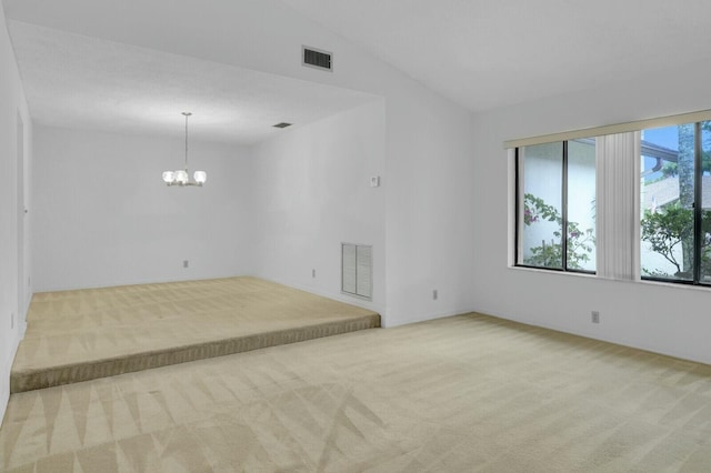 18356 181st Cir S, Boca Raton, FL 33498 - carpeted spare room featuring visible vents, an inviting chandelier, and vaulted ceiling