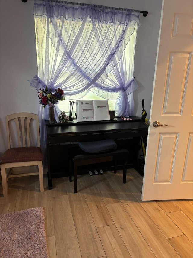 sitting room featuring light wood-style flooring