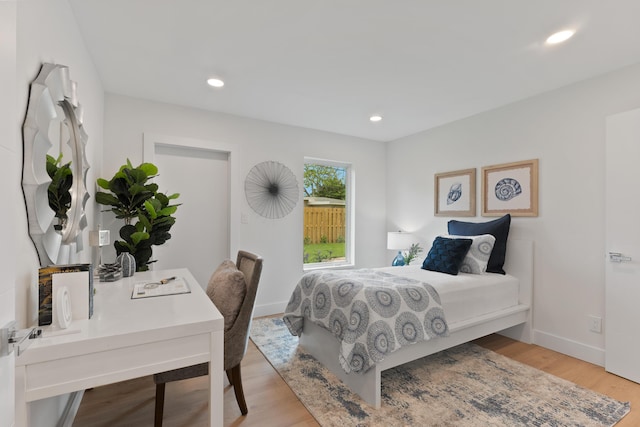 bedroom featuring light wood-style floors, baseboards, and recessed lighting