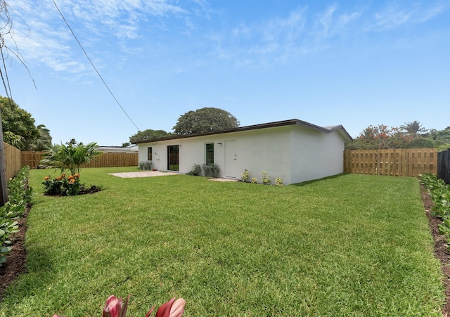 view of yard with a fenced backyard and a patio area