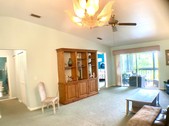 10501 SE Croft Ct Unit D-8, Hobe Sound, FL 33455 - living room featuring carpet, ceiling fan with notable chandelier, baseboards, lofted ceiling, and visible vents