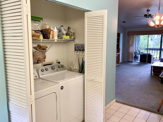 10501 SE Croft Ct Unit D-8, Hobe Sound, FL 33455 - washroom featuring laundry area, light colored carpet, baseboards, light tile patterned floors, and washing machine and dryer