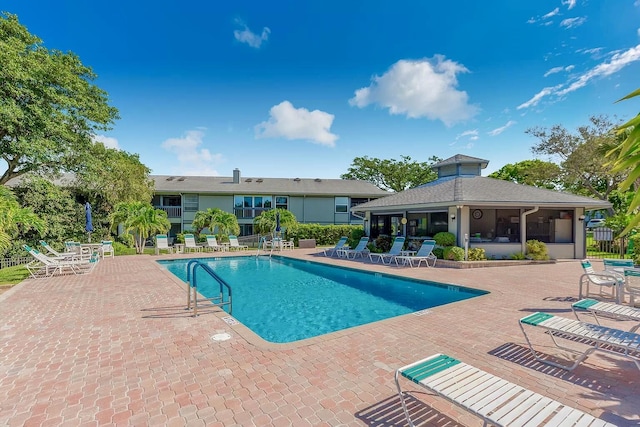 10501 SE Croft Ct Unit D-8, Hobe Sound, FL 33455 - community pool with fence and a patio area