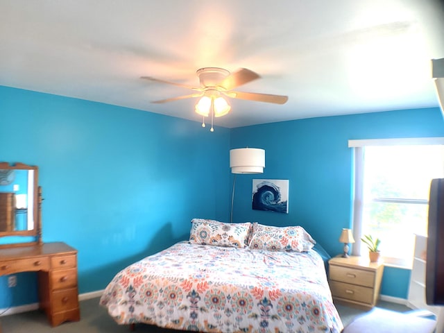 10501 SE Croft Ct Unit D-8, Hobe Sound, FL 33455 - bedroom with baseboards, ceiling fan, and carpet flooring