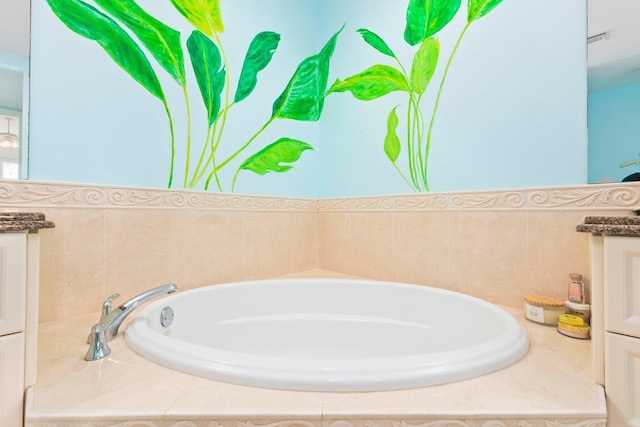 bathroom with a bath and vanity
