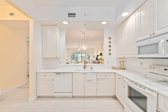 kitchen with a sink, light tile patterned flooring, white appliances, visible vents, and recessed lighting