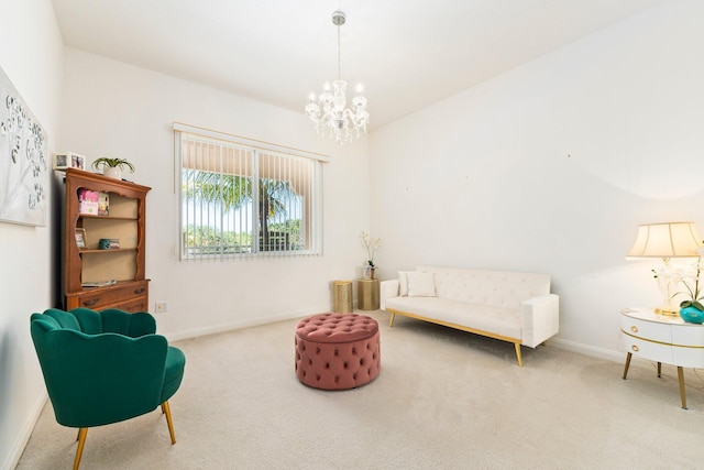 living area with baseboards, carpet flooring, and a chandelier