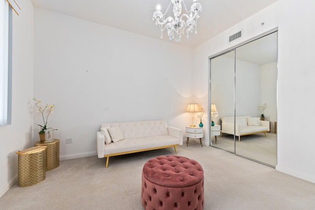living area with baseboards, carpet flooring, a chandelier, and visible vents