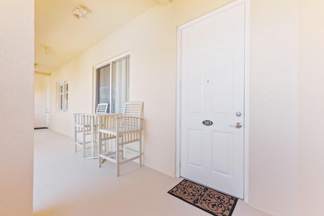 property entrance featuring stucco siding