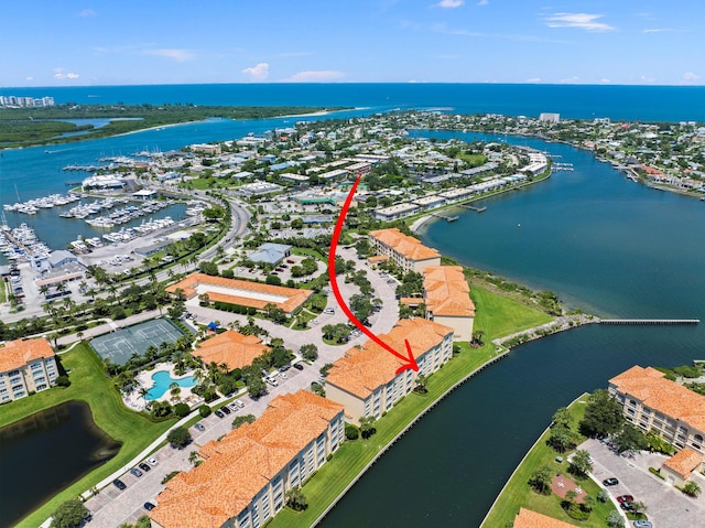 birds eye view of property featuring a water view
