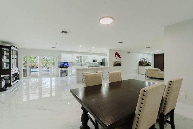dining room featuring marble finish floor, visible vents, and recessed lighting