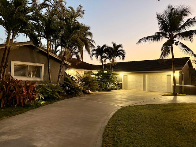 16250 SW 274th St, Homestead, FL 33031 - view of front of property featuring driveway, stucco siding, and a garage