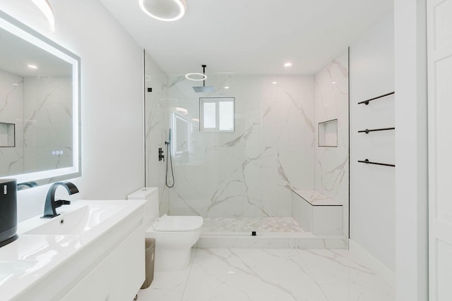 full bathroom featuring a sink, toilet, marble finish floor, a marble finish shower, and double vanity