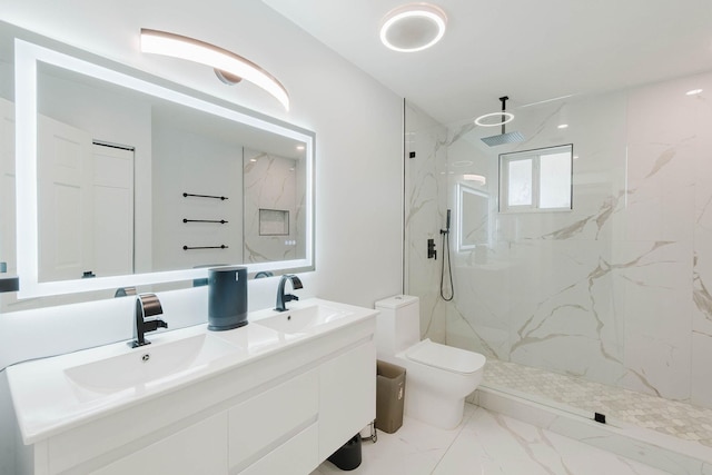full bath with double vanity, toilet, a marble finish shower, a sink, and marble finish floor