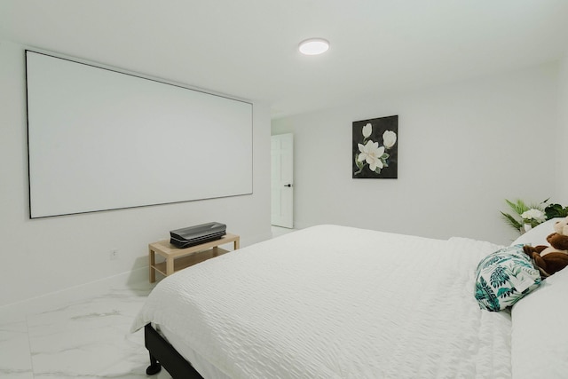 bedroom featuring marble finish floor