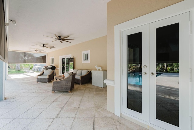 view of patio / terrace with ceiling fan, an outdoor hangout area, and french doors