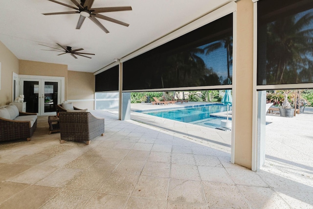 pool featuring a patio area, french doors, and ceiling fan