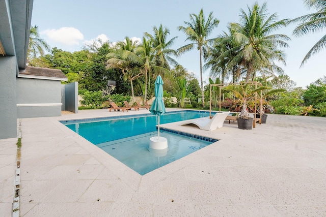 outdoor pool with a patio