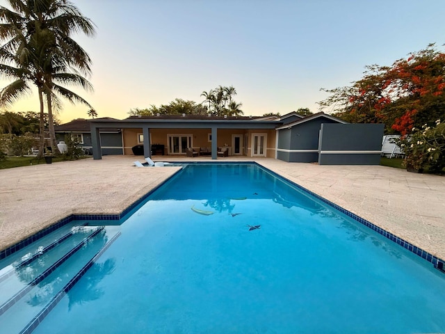 16250 SW 274th St, Homestead, FL 33031 - swimming pool with french doors and a patio