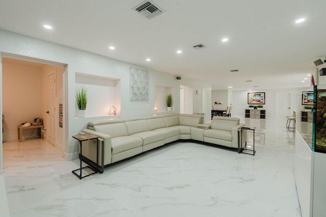 living room with marble finish floor, visible vents, and recessed lighting
